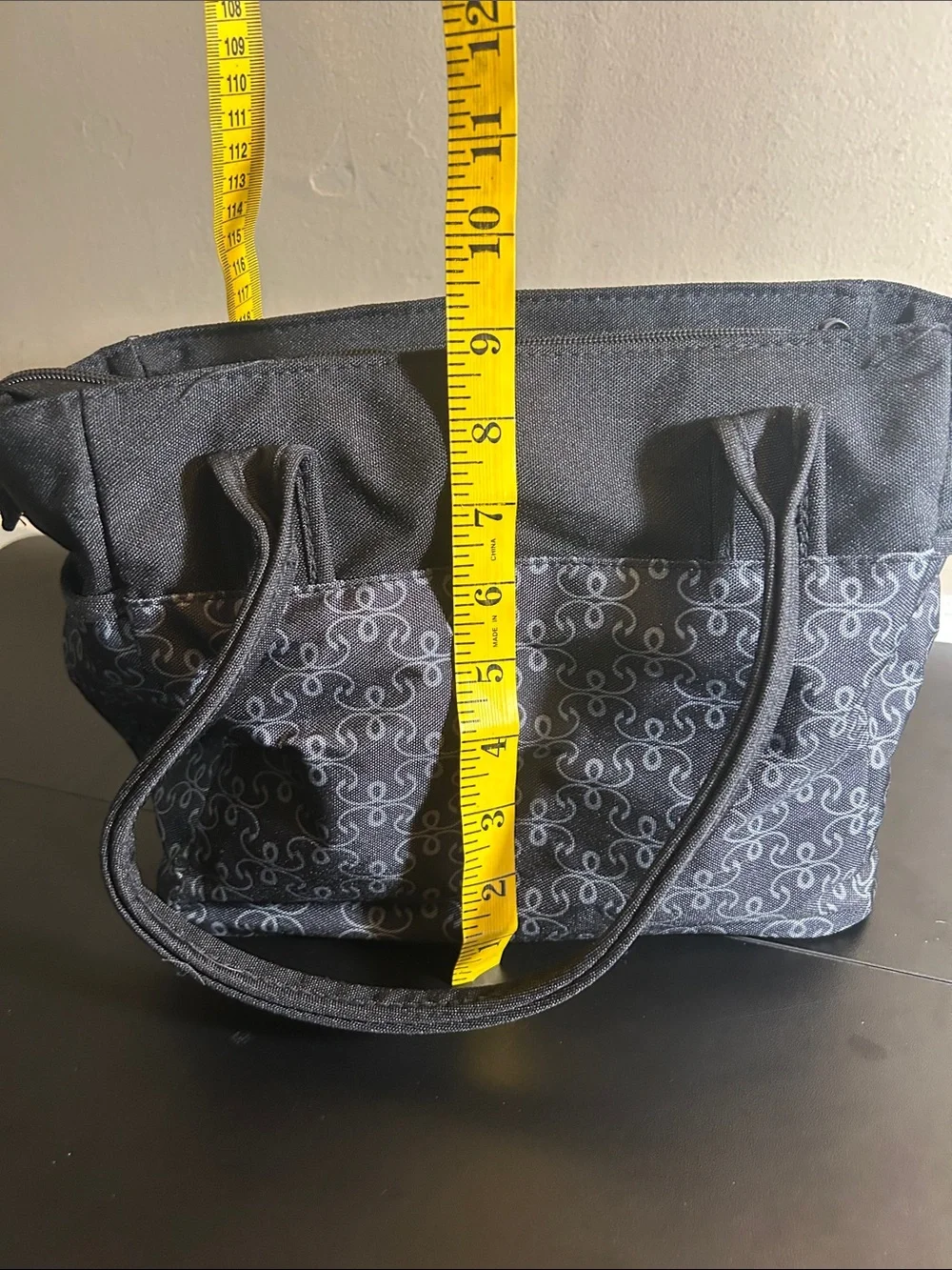 The First Years black and grey patterned canvas diaper bag tote